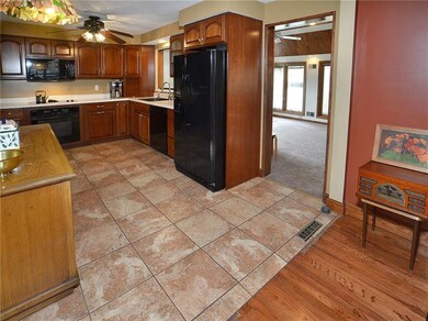 The kitchen opens to the dining room, and thru the doorway into the first-floor family room addition.  Perfect for entertaining!