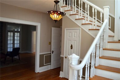 Grand staircase greets guests in the foyer...