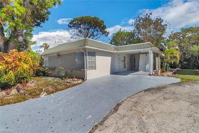 View of front of home with a carport