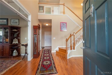 Entrance foyer with a high ceiling and light wood-