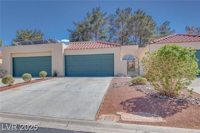 View of front facade with an attached garage, conc
