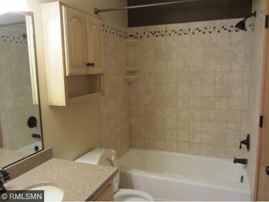 Main level bathroom walk thru to master.  Tile sur