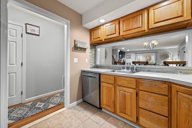Kitchen entrance with 1/2 bath in hallway.
