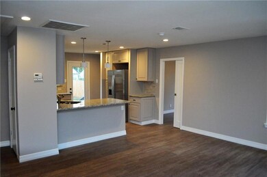 Custom cabinets, open floor plan wth breakfast bar