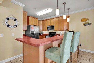 Kitchen with a breakfast bar area, appliances with