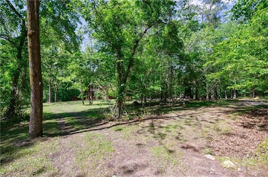 View of yard with a wooded view