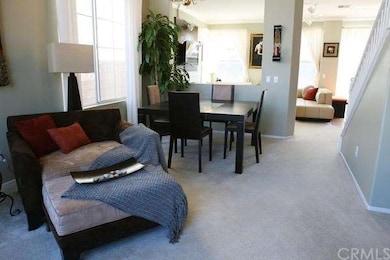 See how the living room flows naturally to the fam