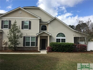 Coveted end unit with private fenced backyard