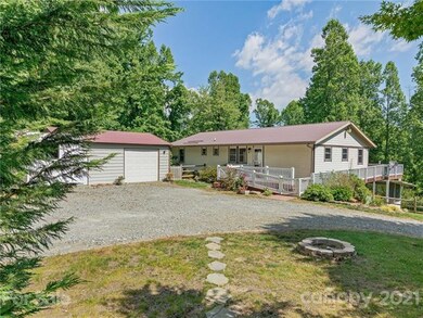 Plenty of level parking plus a garage shop with one bay and loads of room for a workshop.