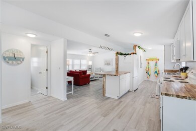 Kitchen featuring ceiling fan, light hardwood / wo