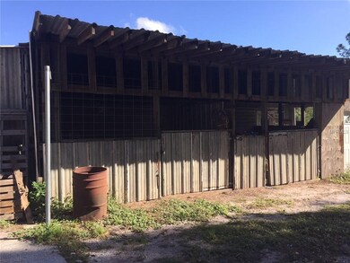 Two stall horse barn has been added on to the one car garage and guest apartment.