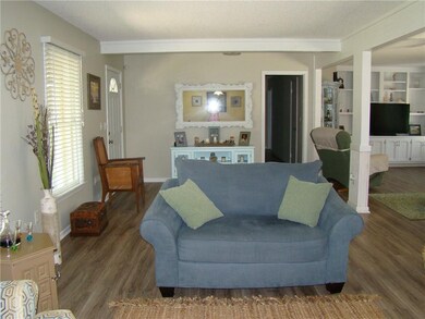 Front door to the left, bedrooms down the hall.