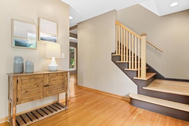 Spacious Entry with an open staircase and hardwood floors greet you upon walking in.