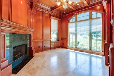 Unfurnished living room featuring a fireplace, cof