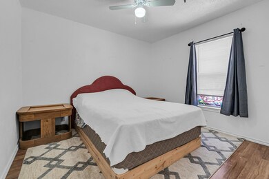 Bedroom featuring light wood-type flooring and ceiling fan