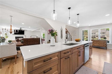 Kitchen with dishwasher, a sink, recessed lighting