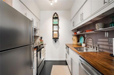 Kitchen featuring a sink, butcher block countertop