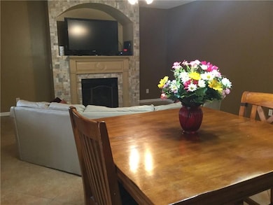 Dining room with light tile patterned flooring, a 