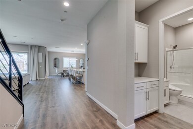 Hallway featuring light wood-type flooring and recessed lighting