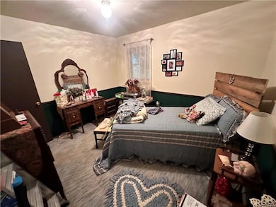 Bedroom featuring carpet flooring