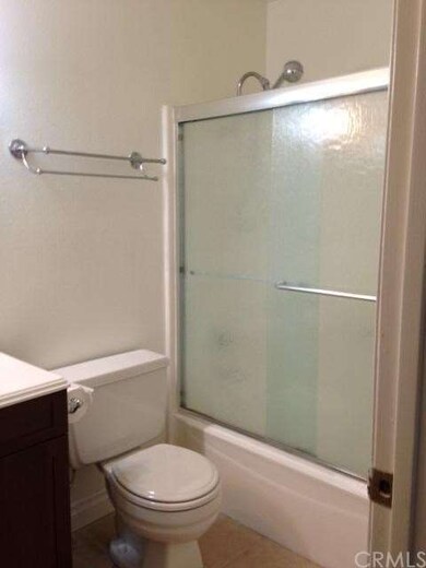 Bathroom with tile floor, newer vanity & shower do