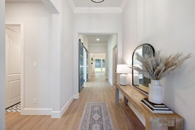 This bright and spacious hallway seamlessly connec