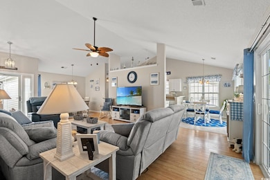 Living room with light wood-style flooring, ceilin