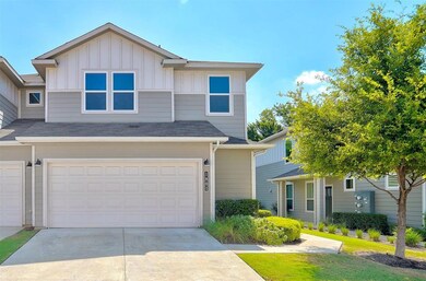 Townhome / multi-family property with concrete dr