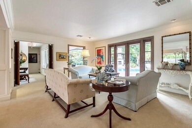 Sitting area off living room.  Double french doors