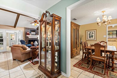 Dining space featuring ceiling fan with notable ch