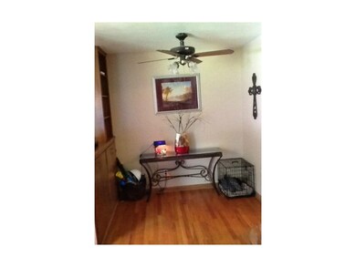 DIning Room has hardwood floors and a ceiling Fan!