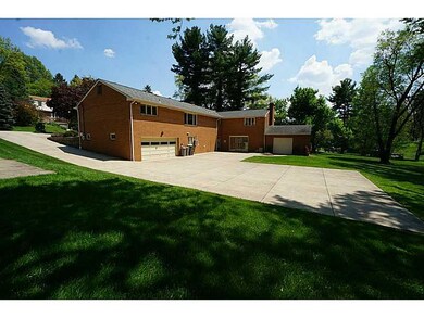 Exterior Back. Amazing concrete driveway continues