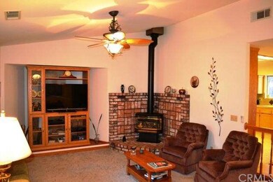 The brick hearth freestanding fireplace is perfect