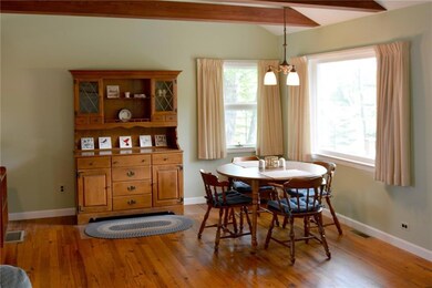 Open concept dining room with pine...