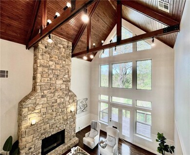Soaring cathedral ceiling with beadboard trim and custom wood beams!