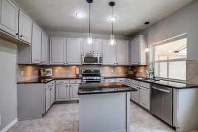 Large Kitchen Window Overlooking the Back Yard