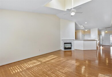 Family room with view into kitchen and foyer