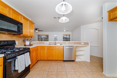 This kitchen seamlessly opens up to the family roo
