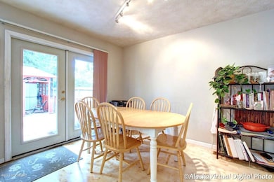 Dining area w/ access to large deck/yard