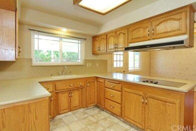 View of kitchen opening into family room. Lots of 