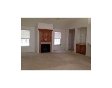 Living Room. Large open living room with gas fireplace.
