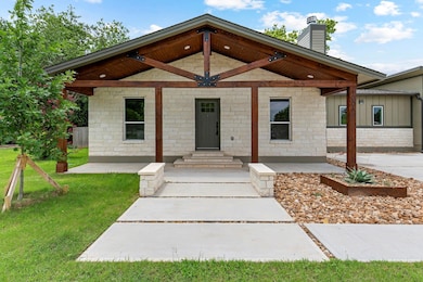 View of front facade featuring a front lawn, a ch