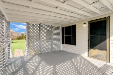 Deck by the front door with privacy screening,
