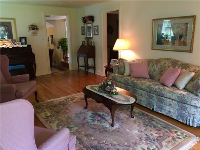 Large formal living room with hardwood floors and 