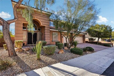 View of front of house featuring a garage and driv