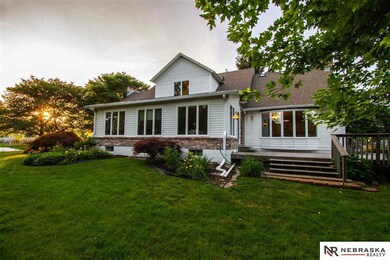 Welcome to this beautiful home. A jewel in Bellevue! Expansive lawn, under beautiful trees.  Surrounded by flower beds and gorgeous greenery. This home is all you dream of! Large deck, sun room overlooking the lawns. Brick walk ways, large two car garage!