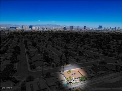 View of urban area featuring a mountain backdrop and nearby suburban area