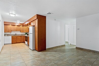 Spacious living room open to mode4rn kitchen