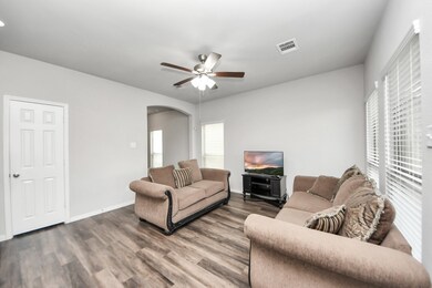 Another view of the bright, modern living room wit