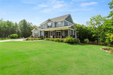 View of front of house with covered porch and board and batten siding